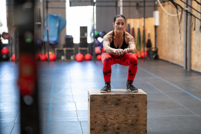 Fit woman doing box jumps