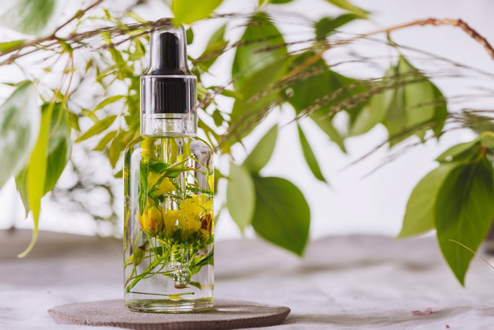 Essential oil, with flowers and natural herbs