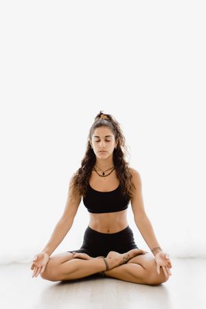 Woman meditating in lotus position