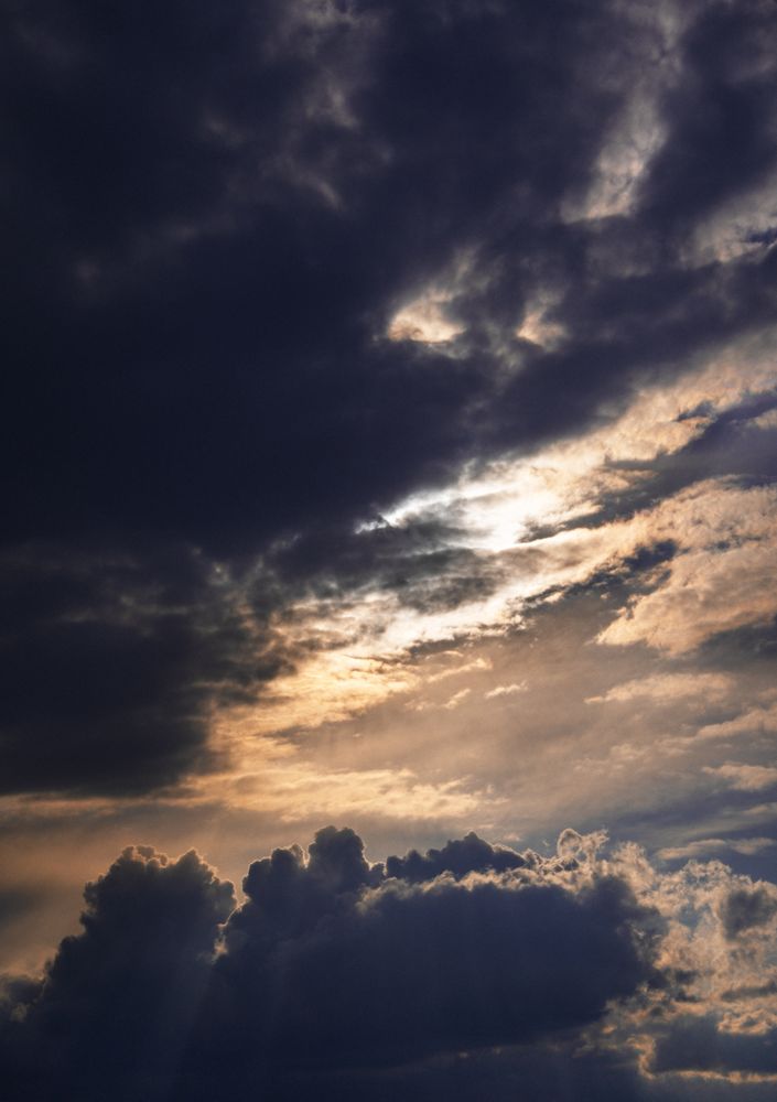 Vertical orientation of grey clouds in the dusk sky