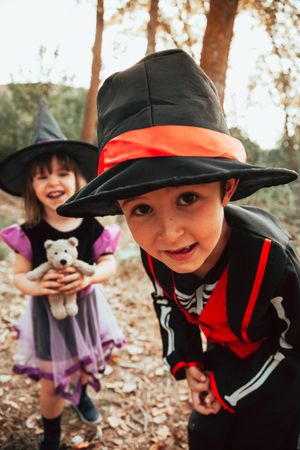 Brother and sister in halloween costumes