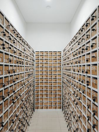 A Long Corridor of Lockers: Rows of numbered compartments, a maze of keys and storage