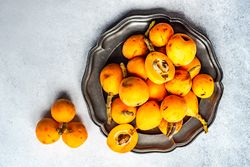Plate of ripe  loquat fruits