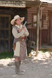 "Pistol Packin' Paula" Saletnik is the resident gun-twirler, Enchanted Springs Ranch, Boerne, Texas v4NWeb