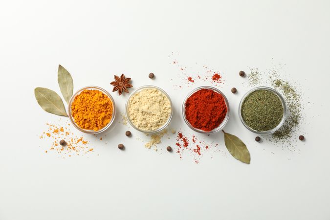 Top view of line colorful spices in bowls