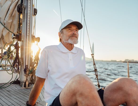 Mature man relaxing on sailboat