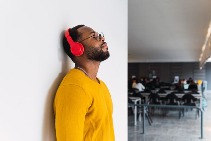 Black man listening to music in headphones