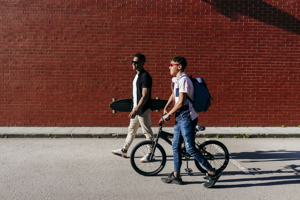 Young Black men walking in city