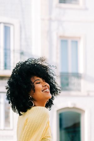 Black female standing on street