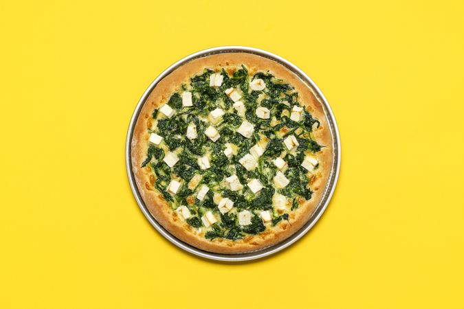 Spinach pizza with mozzarella and feta cheese
