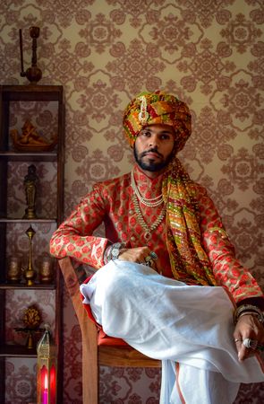 Man wearing turban sitting on chair