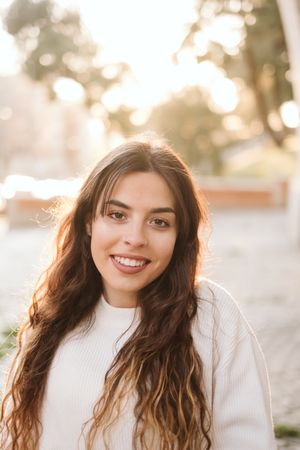 Cheerful young woman in street