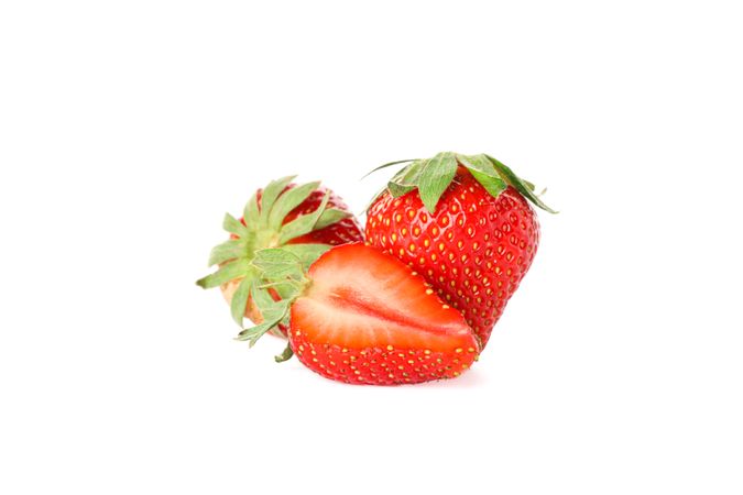 Strawberries isolated on light background. Summer sweet fruits and berries