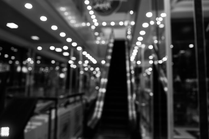 Blurred photo of escalator and lights in shopping center