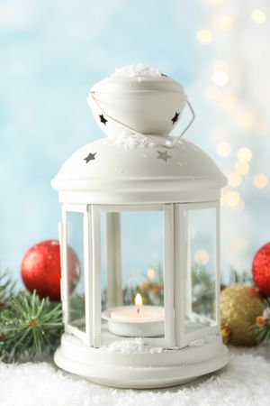Christmas lantern on decorated background, space for text