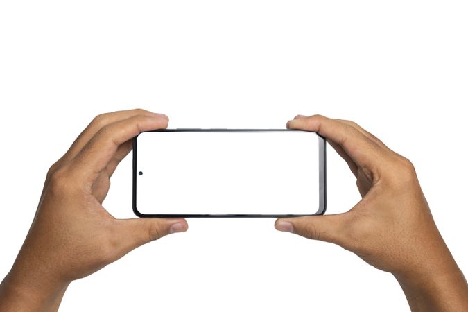male hand holding smartphone horizontally with blank screen smartphone.