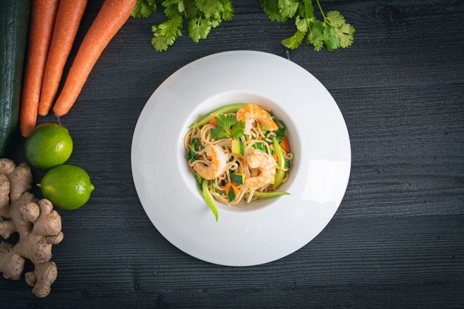 Tasty Pad Thai of vegetables and prawns in plate