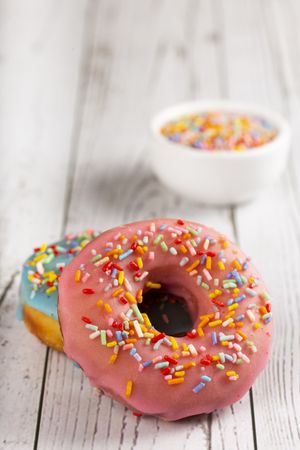 Delicious assorted colorful donuts on the table.