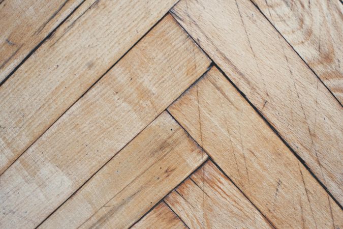 Close up of herringbone pattern on wooden floor