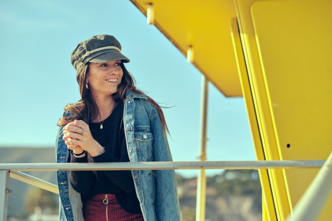 female standing on balcony on nature