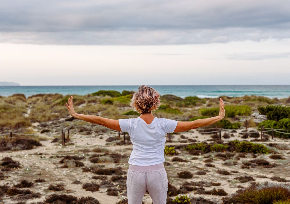 Adult woman practicing martial arts in nature