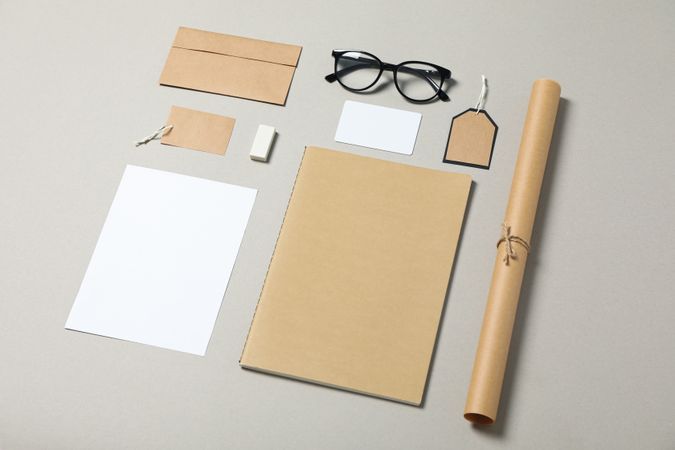Mockup. Corporate stationery and glasses on grey background, copy space