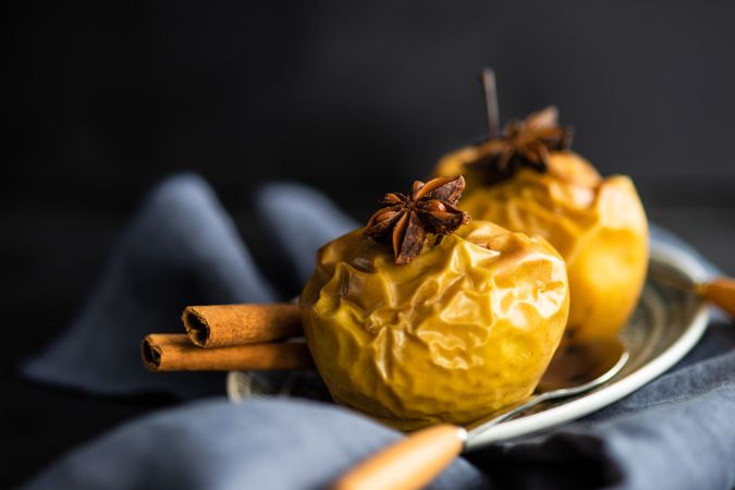 Plate of baked apple topped with star anise