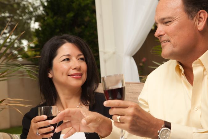 Hispanic Woman and White Man Enjoying Wine