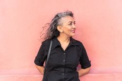 Grey-Haired Modern Woman Standing In The City