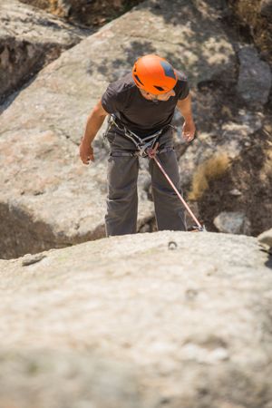 Man climbing a rock