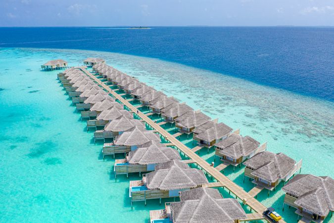 Two rows of overwater bungalows in the Maldives