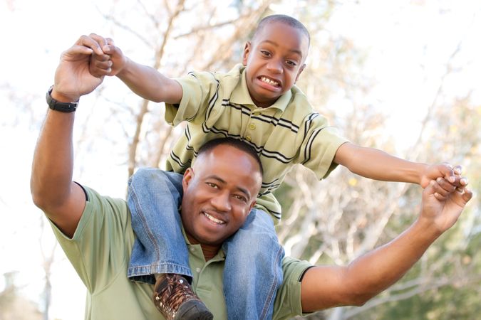 Black Man and Child Having Fun