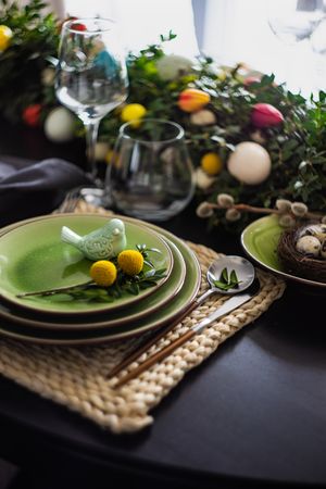 Decorative bird on plate for spring table setting