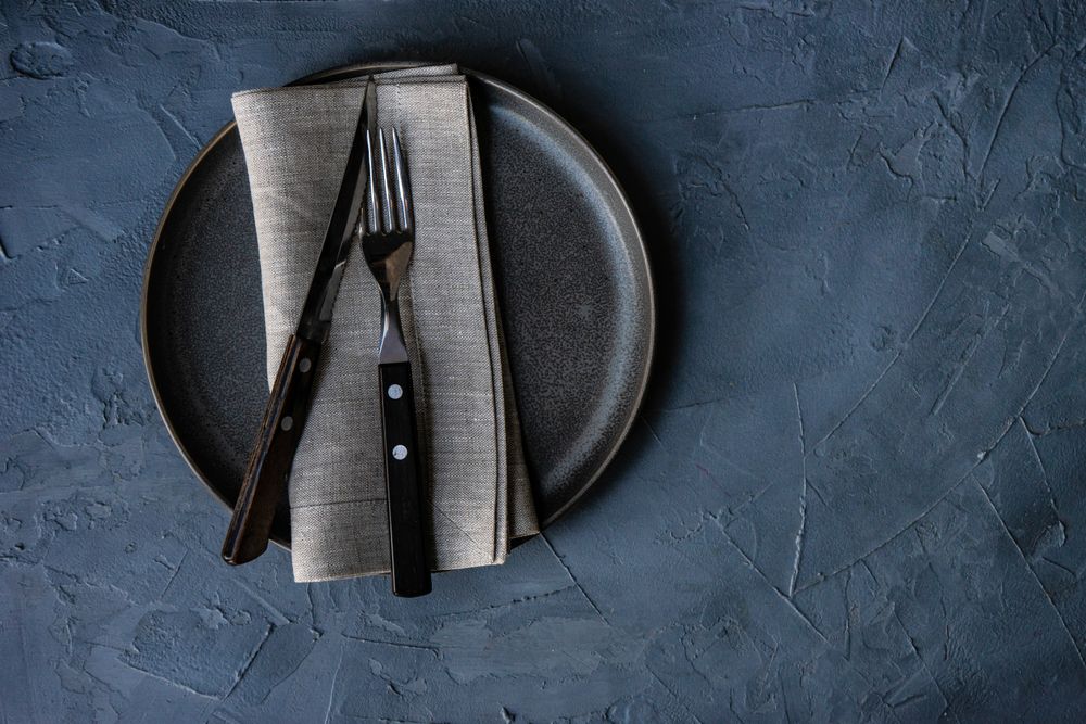 Top view of grey plate and napkin