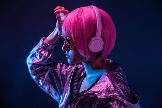 Trendy woman listening music with headphone