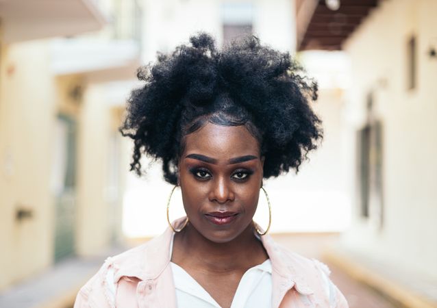 Portrait of a pretty Black woman with afro hair
