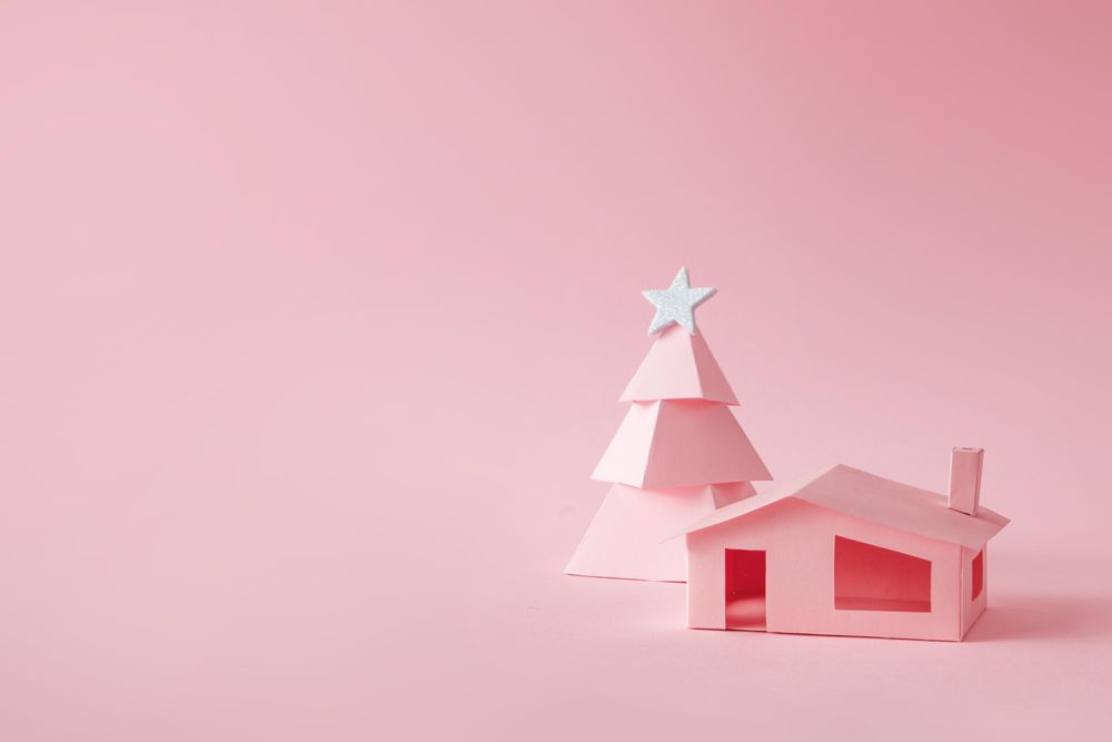Pink Christmas tree, with house on pink background