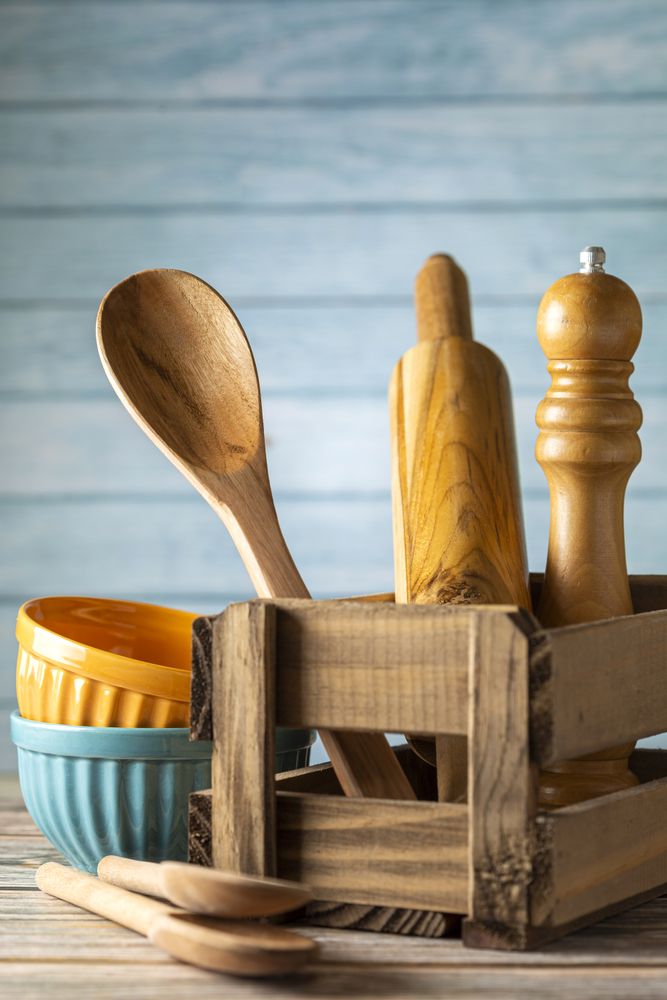 kitchen utensils on wooden background.