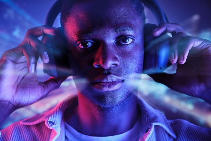 Black man in headphones listening to music