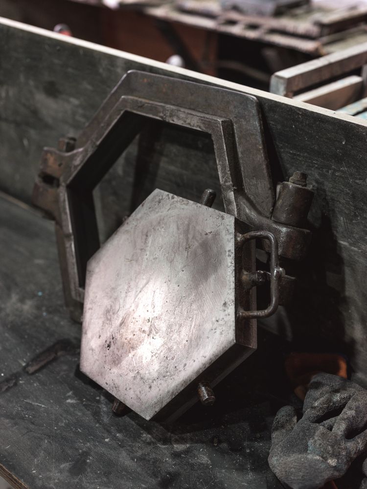 Metal mold with vice grip in workshop