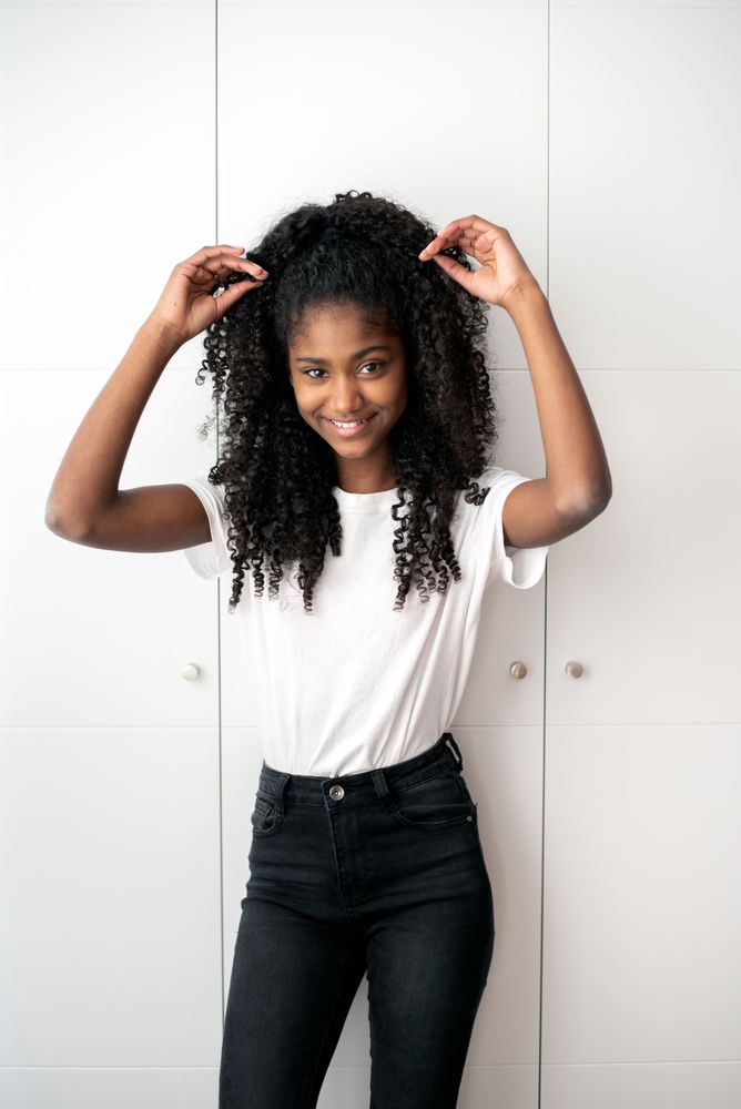 Portrait of a beautiful young Black teenage girl looking into camera