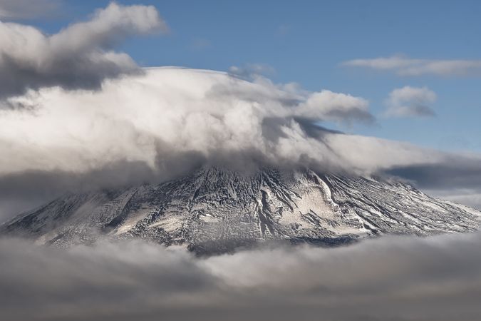 Mountain peaks covered by snow in warn sun light