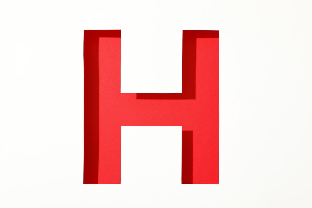 Color letter H on blank background, space for text