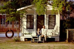 Young and old actors reenact scene from “To Kill a Mockingbird”