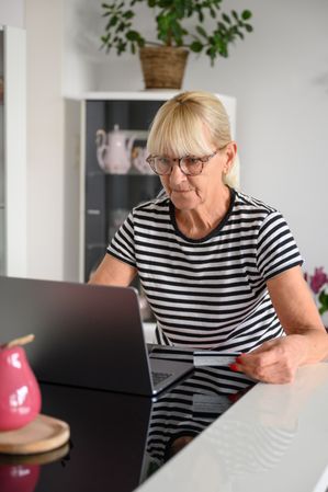 Mature woman working on laptop