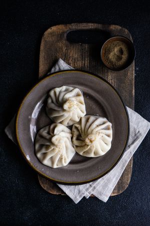 Top view of traditional Georgian khinkali dumplings served on plate