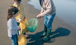 Volunteers taking garbage out of the sea