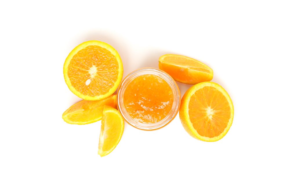 Delicious orange jam isolated on plain background