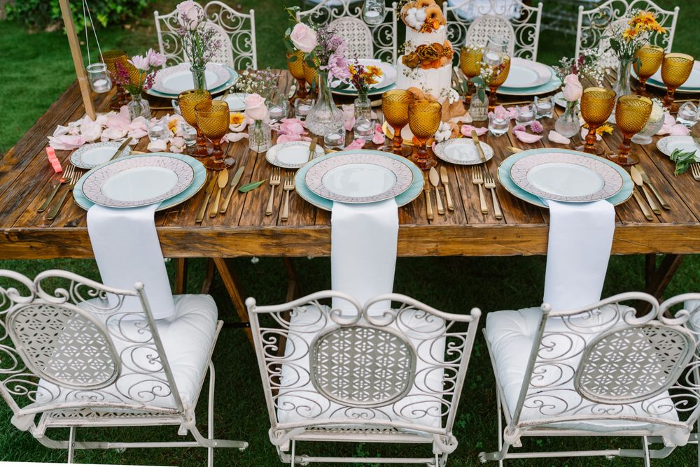 Wedding table decoration in rustic style placed outdoors