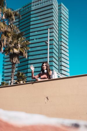 Teen girl watching the street while listening to music.
